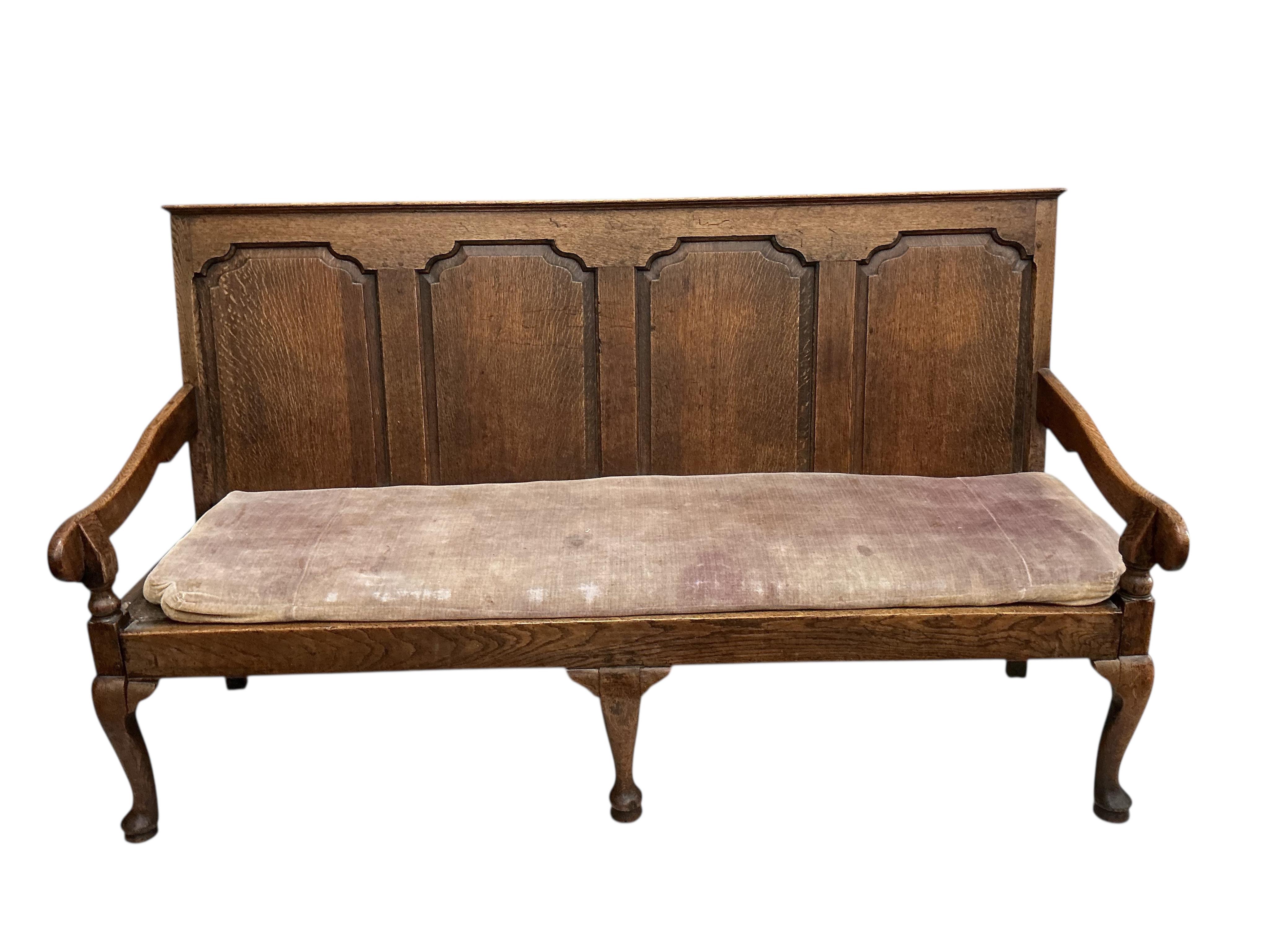 A George III oak settle, width 184cm, depth 64cm, height 107cm